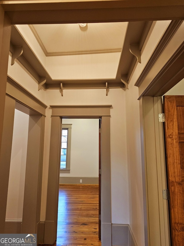 corridor with hardwood / wood-style floors