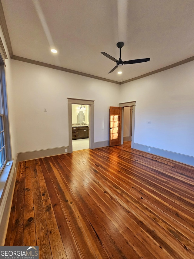 spare room featuring crown molding, ceiling fan, and hardwood / wood-style floors