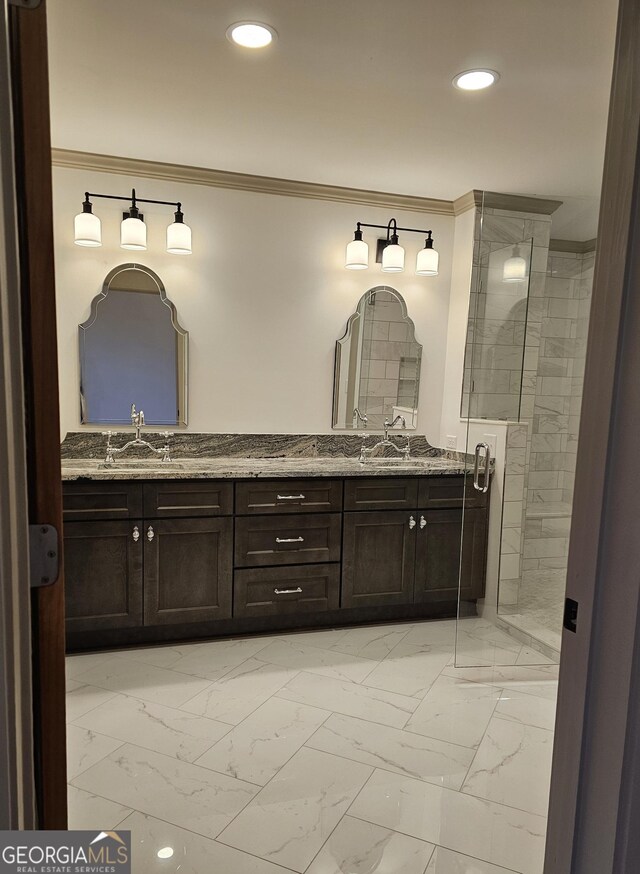 213 W Hightower Trl, Social Circle, GA 30025 - full bath with ornamental molding, double vanity, marble look tiles, recessed lighting, and tiled shower