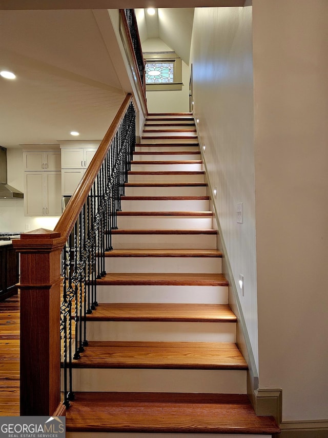 213 W Hightower Trl, Social Circle, GA 30025 - stairs featuring baseboards, wood finished floors, and recessed lighting