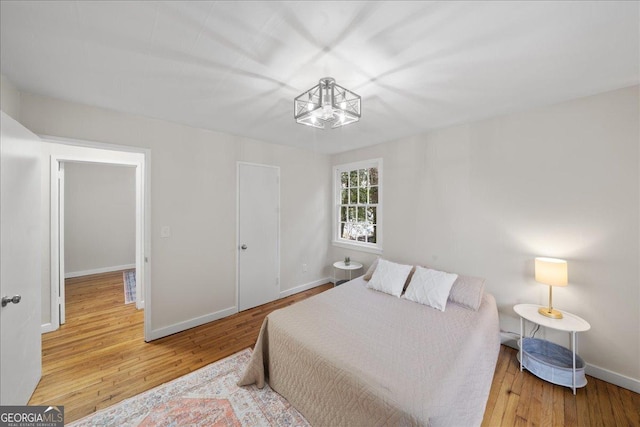 bedroom with hardwood / wood-style floors