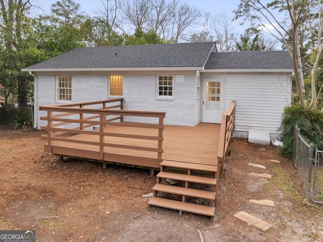 back of property featuring a deck