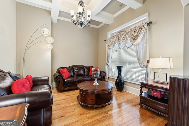 living room with beamed ceiling, hardwood / wood-style flooring, coffered ceiling, a notable chandelier, and crown molding