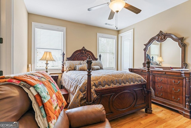 bedroom featuring light hardwood / wood-style floors and ceiling fan