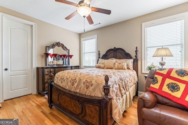 bedroom featuring light hardwood / wood-style flooring and ceiling fan