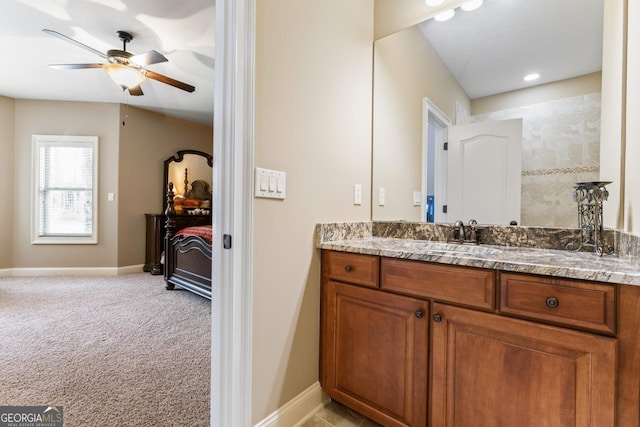 bathroom featuring ceiling fan and vanity