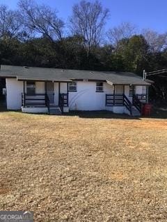 ranch-style home with a front yard