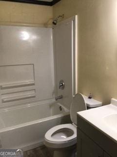 full bathroom with vanity, shower / washtub combination, and toilet