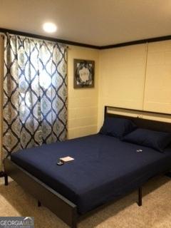 bedroom with crown molding