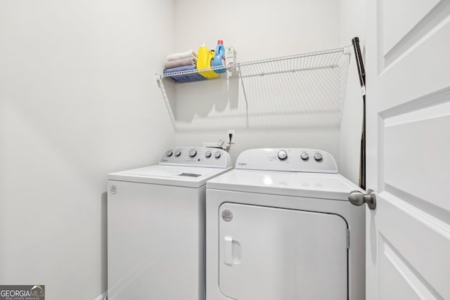 laundry area with washing machine and dryer