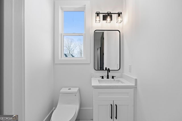 bathroom with vanity and toilet