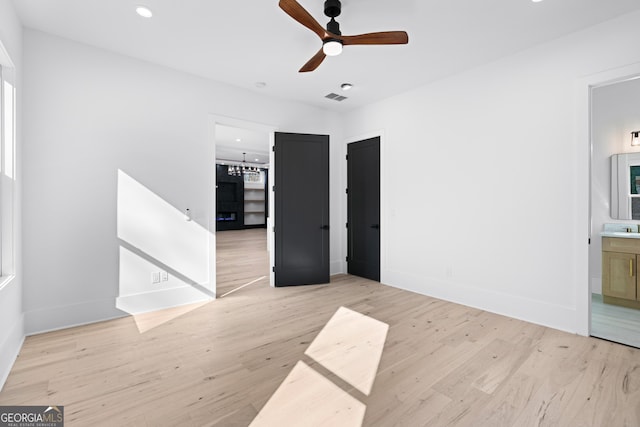 empty room featuring ceiling fan and light hardwood / wood-style floors