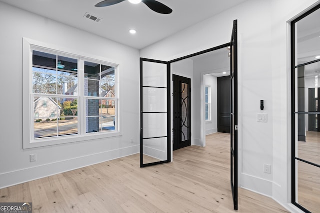 unfurnished bedroom featuring ceiling fan and light hardwood / wood-style floors