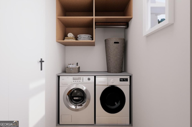 laundry room featuring washing machine and dryer