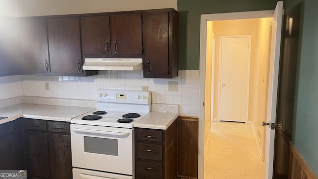 kitchen with dark brown cabinetry, white electric range, and decorative backsplash