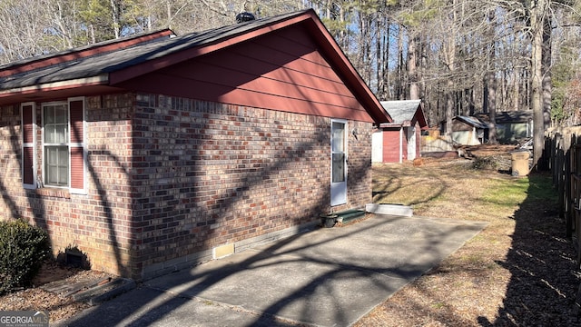 view of side of home featuring a patio