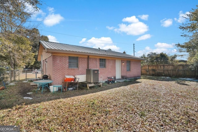 rear view of house with central AC