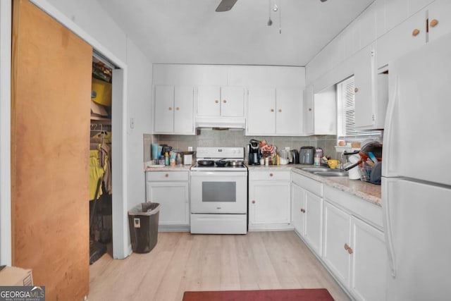 kitchen featuring tasteful backsplash, sink, white appliances, and white cabinets