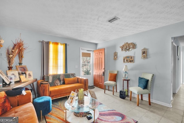 living room with a textured ceiling