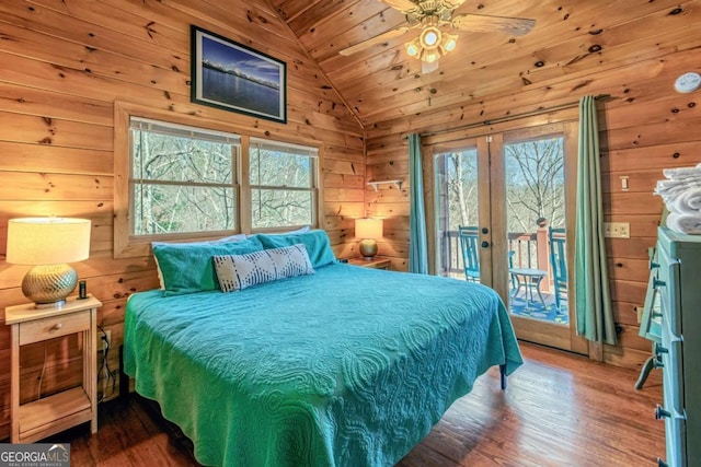 bedroom featuring wooden walls