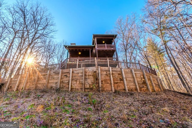 view of front facade featuring a deck with mountain view