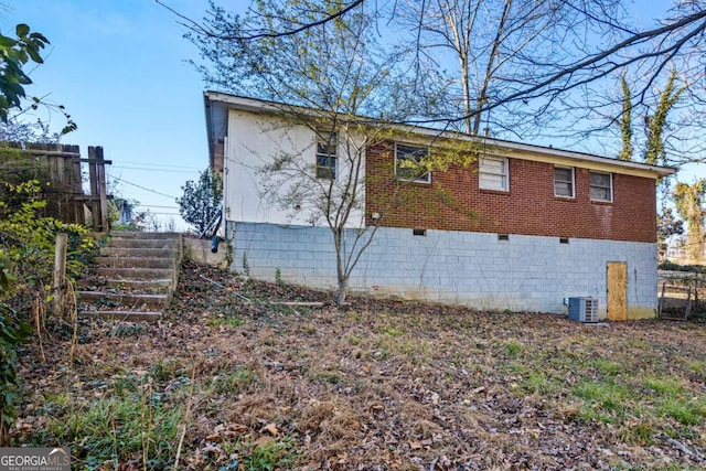 view of side of property with central AC unit