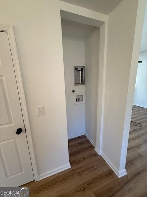 corridor with dark hardwood / wood-style floors