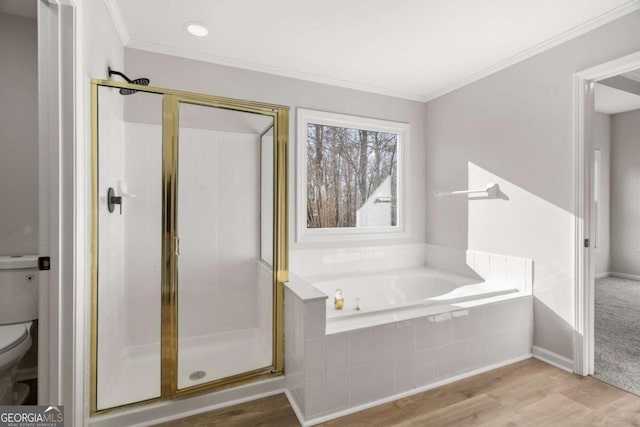 bathroom featuring toilet, shower with separate bathtub, hardwood / wood-style floors, and crown molding