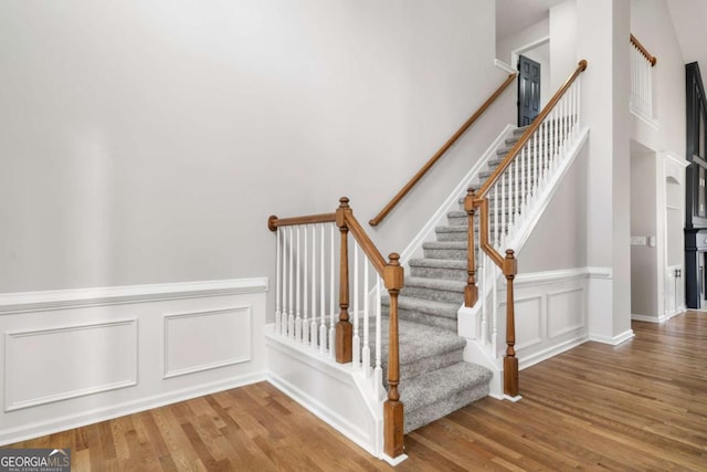 stairway featuring hardwood / wood-style flooring