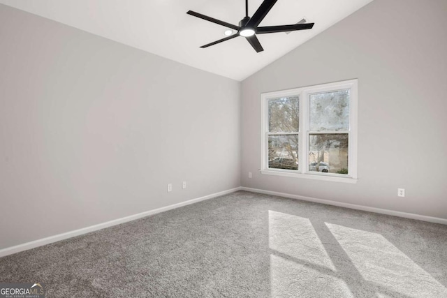 empty room featuring carpet floors, vaulted ceiling, and ceiling fan