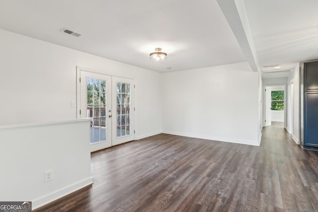 unfurnished room with dark hardwood / wood-style flooring and french doors