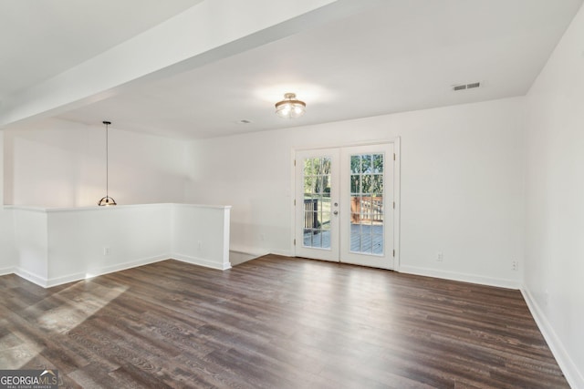 unfurnished room with dark hardwood / wood-style floors and french doors