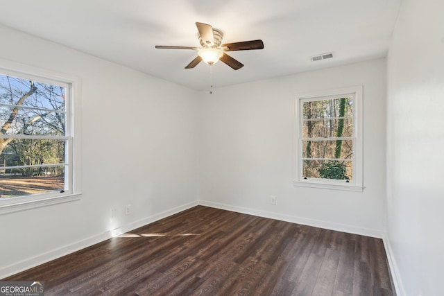 unfurnished room with dark wood-type flooring and ceiling fan