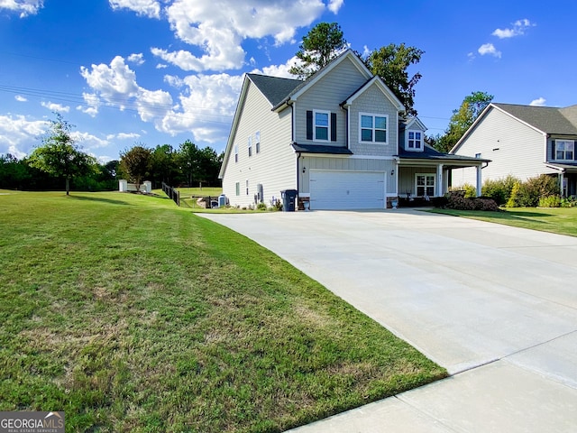 view of side of property featuring board and batten siding, an attached garage, driveway, and a yard