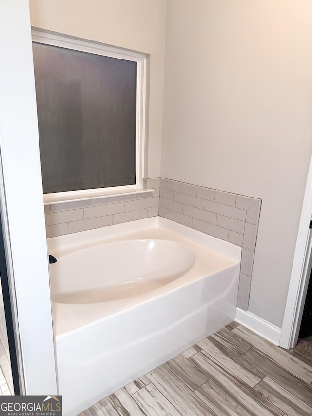 bathroom featuring a tub