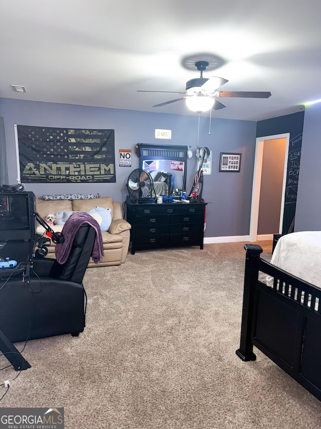 bedroom with ceiling fan, visible vents, baseboards, and carpet