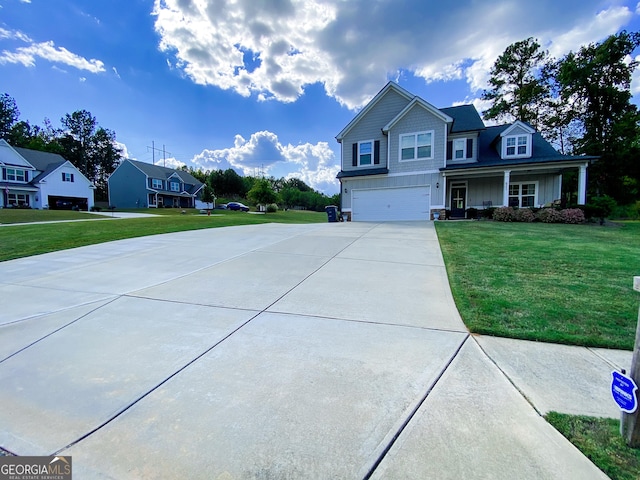 view of front of house with a garage and a front lawn