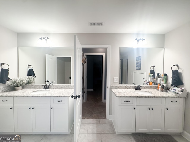 bathroom with vanity and tile patterned flooring