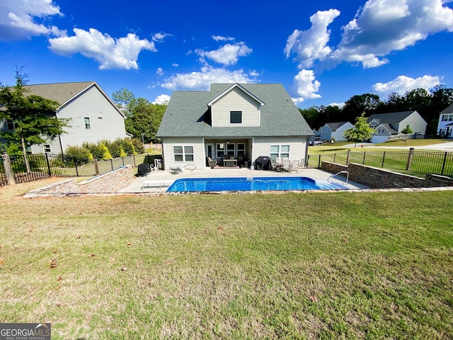 view of pool with a lawn, a fenced backyard, a patio area, and a fenced in pool