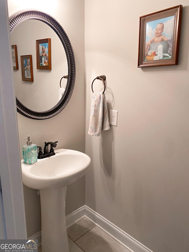 bathroom with tile patterned floors