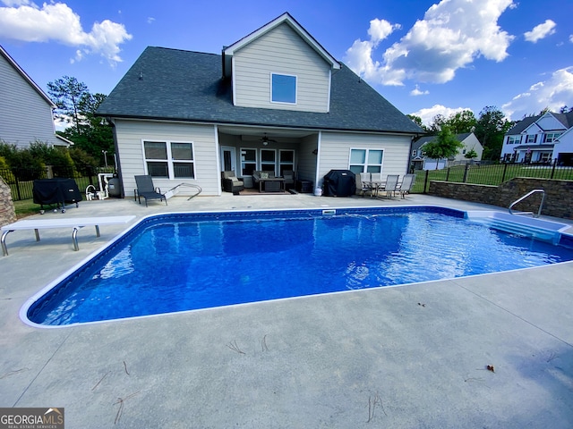 view of pool featuring an outdoor living space, a patio, a grill, and ceiling fan