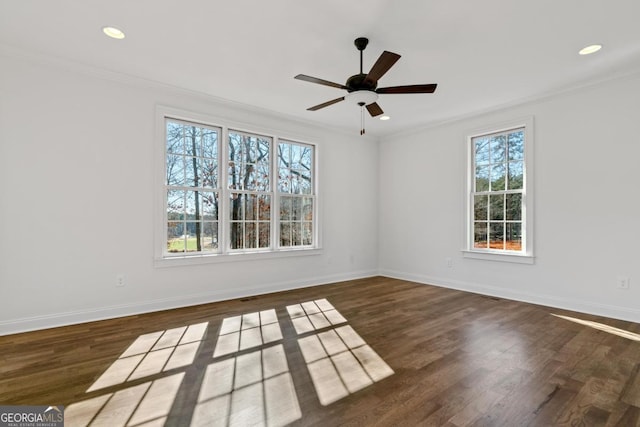 empty room featuring crown molding, ceiling fan, and dark hardwood / wood-style flooring