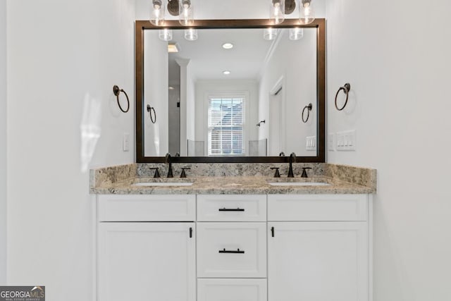 bathroom featuring vanity and ornamental molding