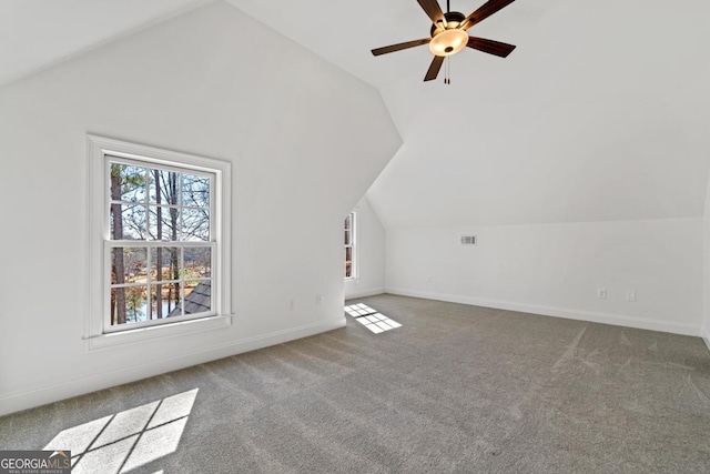 bonus room with lofted ceiling, ceiling fan, and carpet flooring