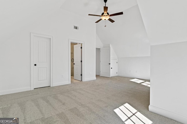 additional living space featuring light carpet, high vaulted ceiling, and ceiling fan