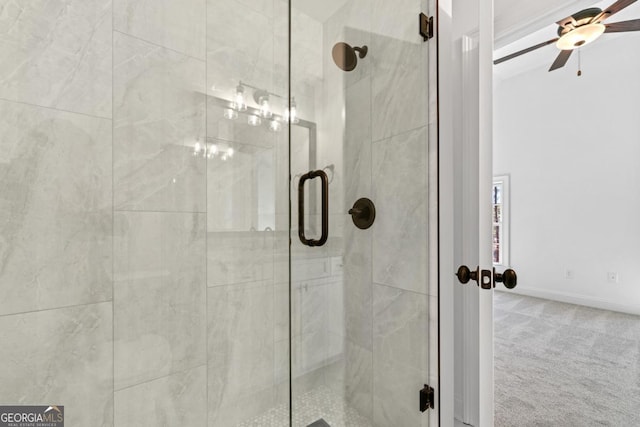 bathroom featuring a shower with door