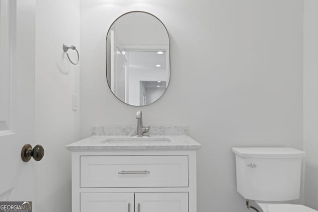 bathroom with vanity and toilet