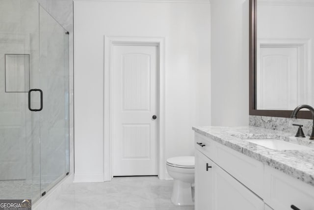 bathroom featuring a shower with door, vanity, and toilet