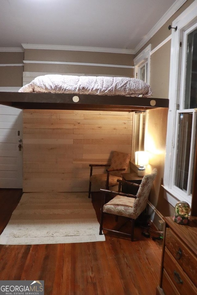 bedroom featuring crown molding and hardwood / wood-style flooring