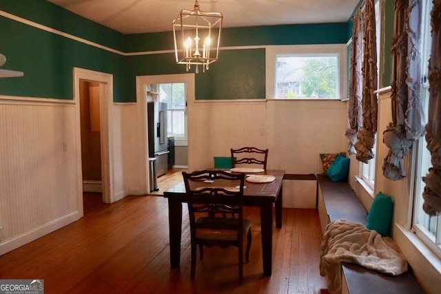 dining room featuring an inviting chandelier and wood-type flooring